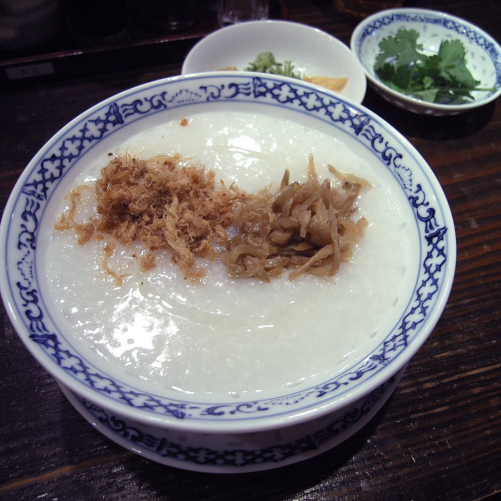 Chicken congee bowl showing the smooth rice texture target