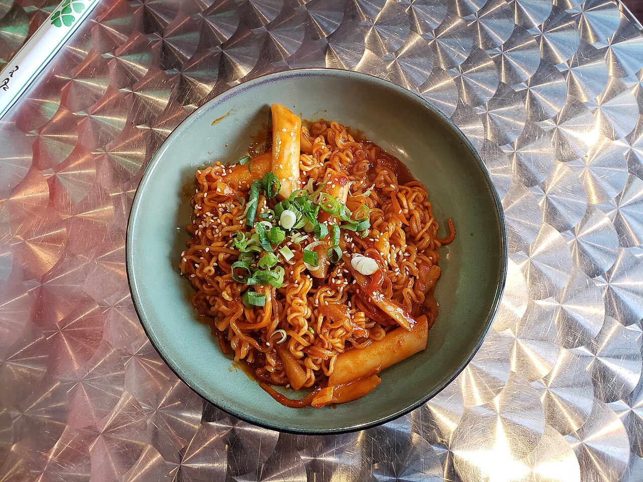 Rice noodle stir fry context for reviewing wok heat, sauce spread, and beef placement