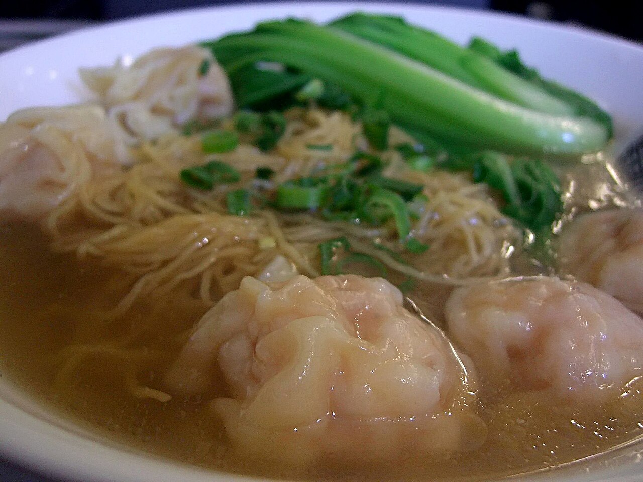 Cantonese wonton noodle soup bowl context for broth and noodle texture