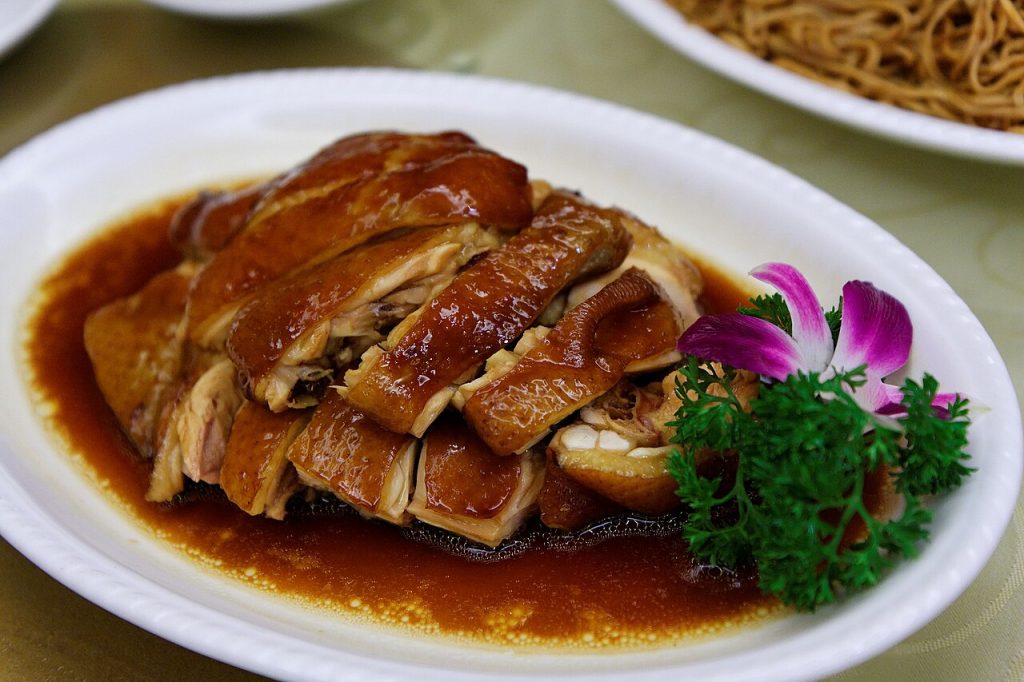 Finished Cantonese chicken serving context for reviewing sauce, texture, and timing
