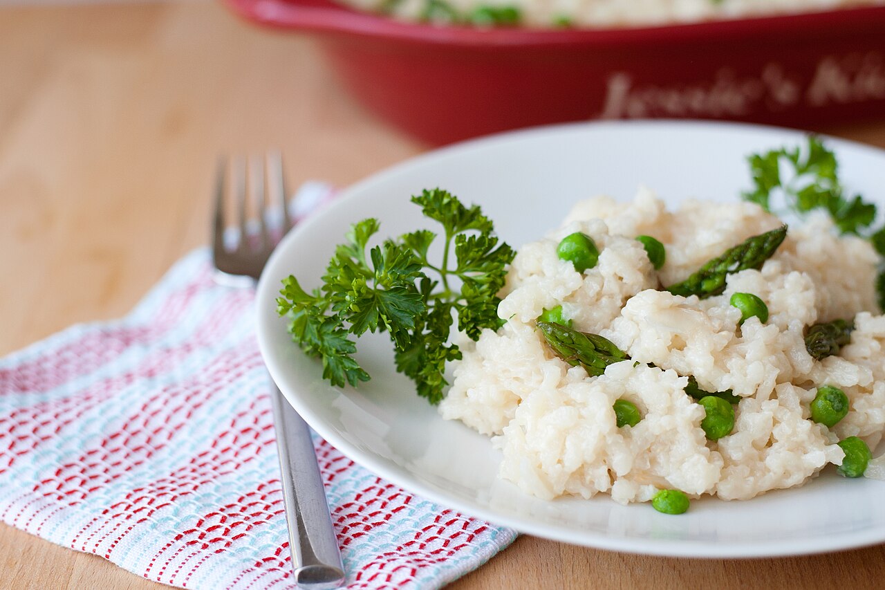 Finished rice casserole serving context for reviewing rice crust, sauce, and topping texture