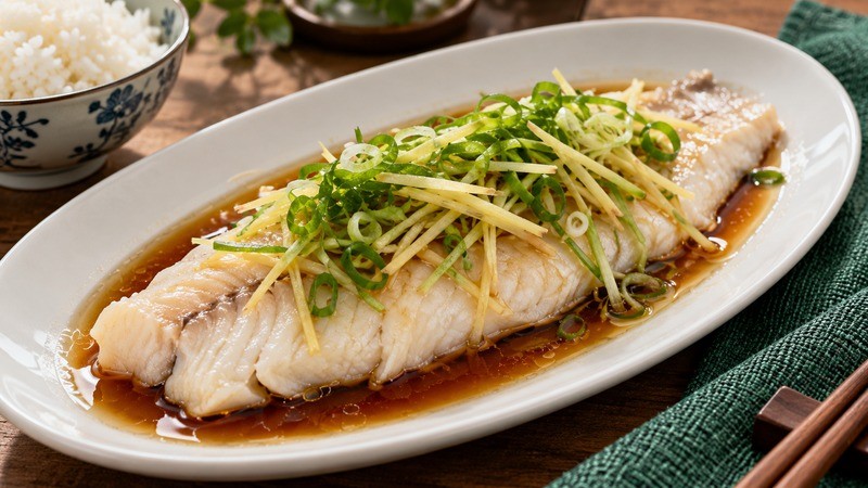 Steamed white-fish fillet topped with ginger and scallion strips