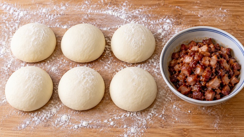 Six wheat-dough portions beside cooled diced char siu filling
