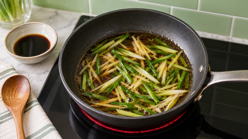 Ginger-scallion soy sauce warming in a small skillet