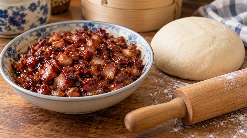 Cooled char siu filling beside soft bun dough