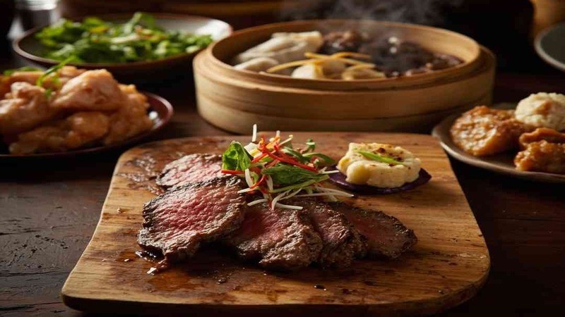 Cooked steak slices on a wooden board