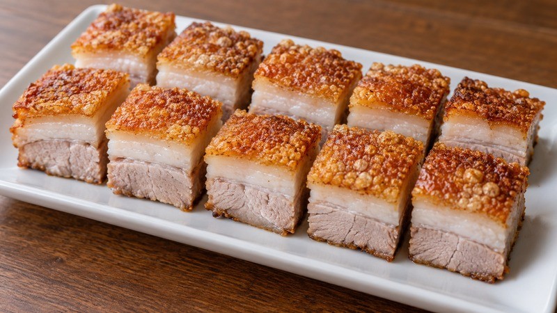 Crisp-skinned Cantonese roast pork with distinct skin and fat layers