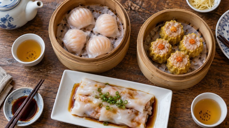 Har gow siu mai and rice noodle rolls arranged as a shared dim sum lunch