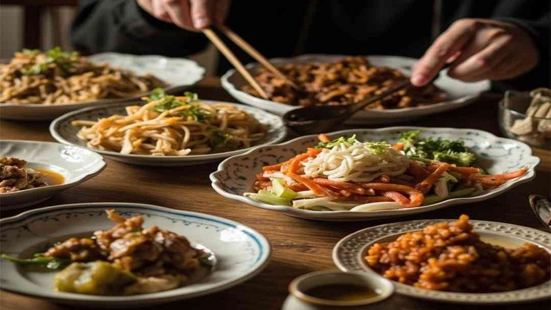 Several shared dishes arranged on a dining table