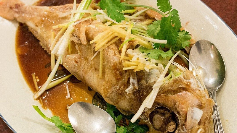 Steamed fish with ginger and scallion in soy-based sauce