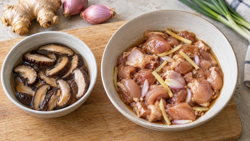 Softened sliced shiitakes and marinated chicken before steaming
