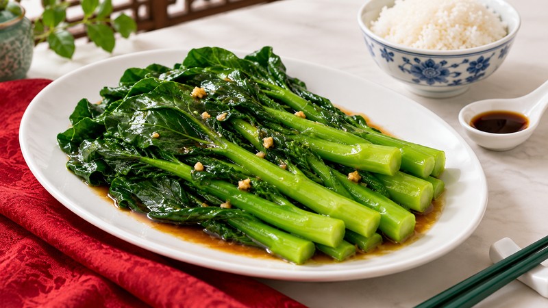 Cooked Chinese broccoli with a light oyster-sauce coating