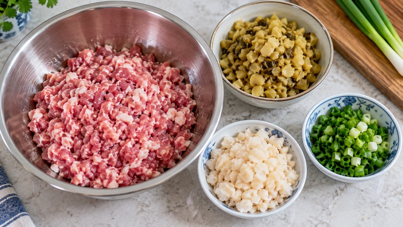 Pork shoulder, mustard tuber and water chestnuts prepared for a steamed patty