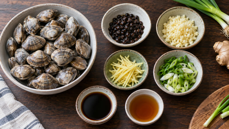 Live clams arranged separately from fermented black beans, garlic, ginger, scallions, soy sauce, and Shaoxing wine
